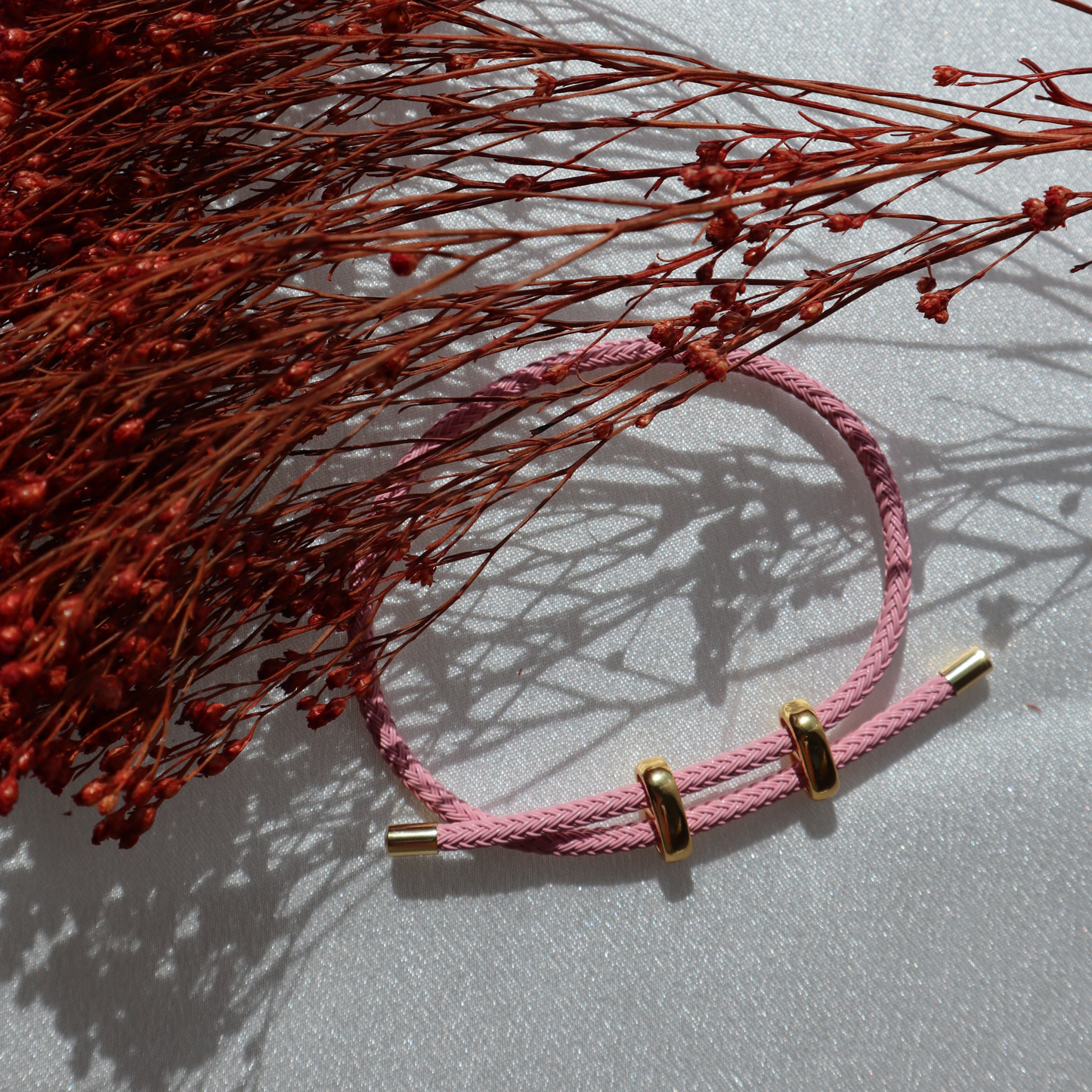 Adjustable Pink Bracelet with Gold Accents